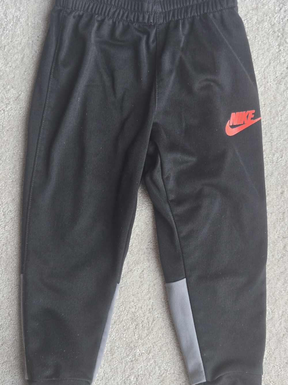 Nike Black Kids Joggers with Red Logo and Gray Panels